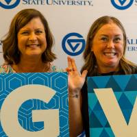 Susan Sigler, holding the G sign, and Megan W holding the V sign, posing with their Anchors Up